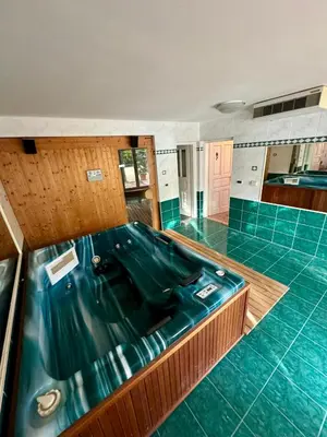 a bath tub in a kitchen with blue tile at Vila Giovana in Vipava