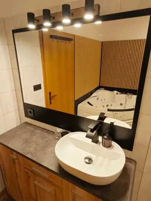 a bathroom with a sink and a large mirror at Wellness soba Amaris in Benedikt v Slovenskih Goricah