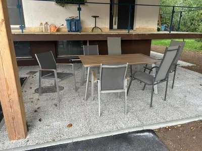 a wooden table and chairs on a patio at Apartment Pr`Jurčk Bled in Bled