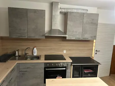 a kitchen with a sink and a stove at Apartment Pr`Jurčk Bled in Bled