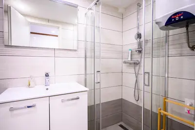 a bathroom with a shower and a sink at The LOFT Ljubljana in Ljubljana