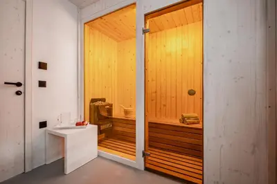 a bathroom with a sauna with a toilet in it at Cottage Retreat with Hot Tub & Sauna in Zgornja Kungota