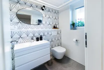 a bathroom with a white sink and a mirror at Mojca's nest apartment in Mengeš