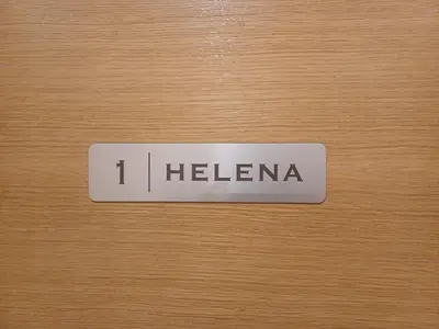 a sign that says i helena on a wooden door at 4 TeTE in Vrhpolje