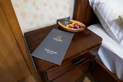 a table with a book and a bowl of toys on it at 4 TeTE in Vrhpolje
