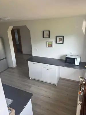 a kitchen with a counter top with a microwave at Apartma Petra in Selca