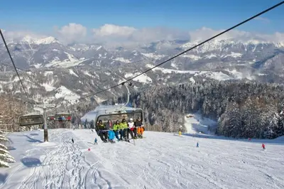 a group of people on a ski lift on a ski slope at Apartma Petra in Selca