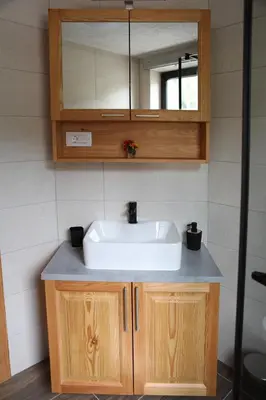 a bathroom with a sink and a mirror at Apartma Saša in Zgornje Jezersko