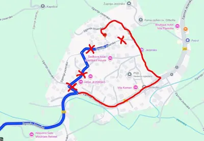 a map with red and blue routes at Apartma Saša in Zgornje Jezersko