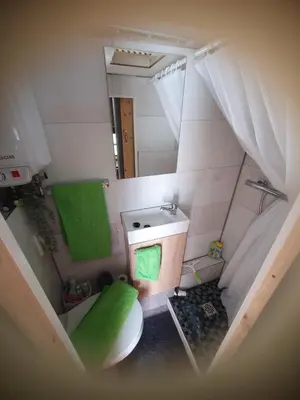 an overhead view of a bathroom with a toilet and a sink at Tepe Retreat in Konjšica