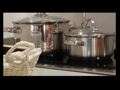 a pot and a basket on top of a stove at Domus Romanus in Ljubljana