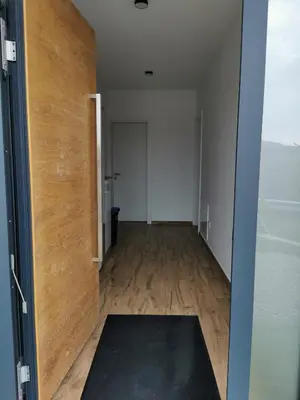 an empty room with a door and a yoga mat at Apartma Gaber in Veliki Gaber