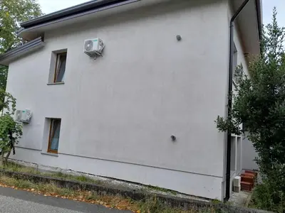 a white wall of a house with an air conditioner at Apartma Dea in Nova Gorica