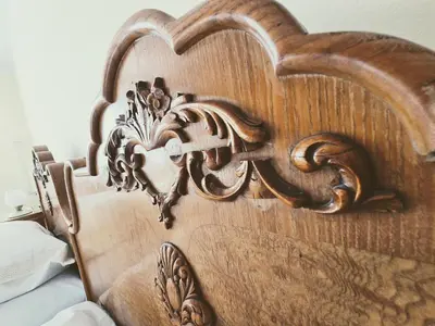 a close up of a wooden headboard of a bed at At Granny's in Maribor