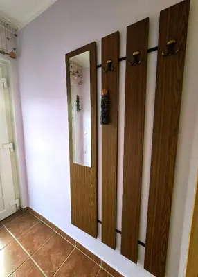 a room with four wooden doors on the wall at At Granny's in Maribor