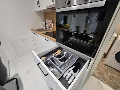 a kitchen with an open drawer with tools in it at GOLDEN OASIS Free Private Parking in Ljubljana