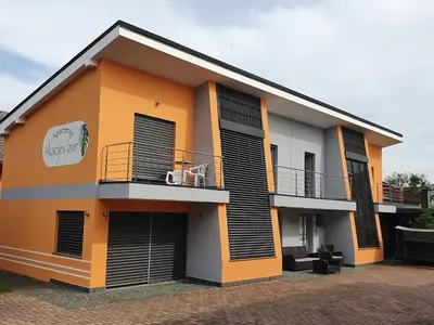 a building with black and orange at Apartments Akacijev Izvir in Miklavž na Dravskem Polju