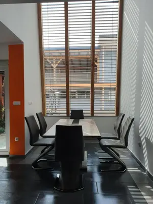 a conference room with a table and chairs at Apartments Akacijev Izvir in Miklavž na Dravskem Polju