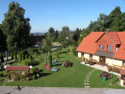 an aerial view of a house with a yard at Farm Stay Pr Lavric in Slivna