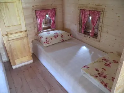 a small room with two beds and two windows at Farm Stay Pr Lavric in Slivna