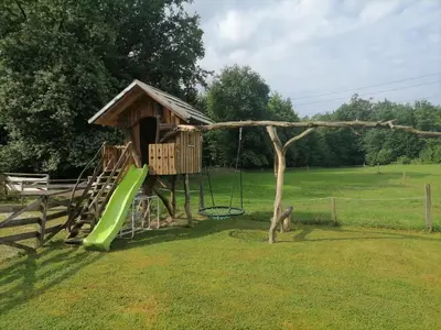 a playground with a slide and a swing at Hemp farm paradise near Bled and Ljubljana in Kranj