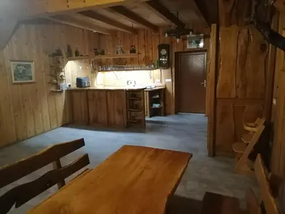 a kitchen with a wooden table in a room at Hemp farm paradise near Bled and Ljubljana in Kranj
