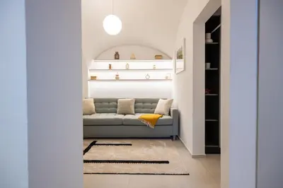 a living room with a couch and a rug at Trubarjeva City apartments in Ljubljana