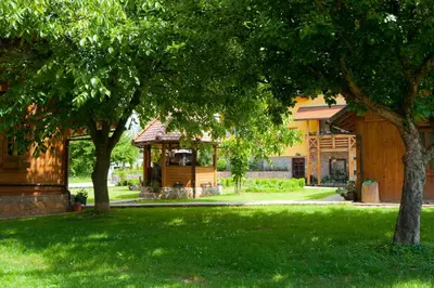 a house with a gazebo in a yard at Tourist Farm Ob izviru Krupe in Semič