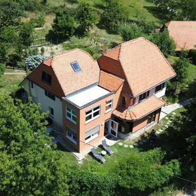 an aerial view of a house with a roof at Forest View Apartment - Sauna & Nature Escape in Slovenska Bistrica