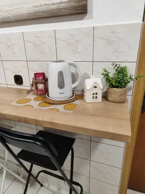 a table with a tea kettle on top of it at Apartma Marko Rogaška in Rogaška Slatina