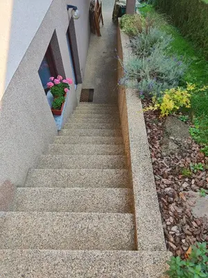 a set of stairs with flowers in a garden at Apartma Marko Rogaška in Rogaška Slatina