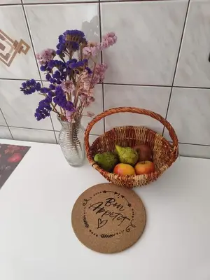 a basket of fruit next to a vase with flowers at Apartma Marko Rogaška in Rogaška Slatina