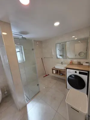 a bathroom with a shower and a sink at Erika's home - apartment house in Šenčur