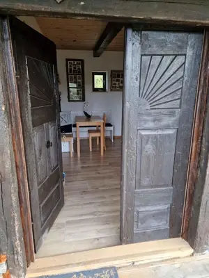 an open door to a room with a table at Cottage in Stara Gora 45720 in Debenec