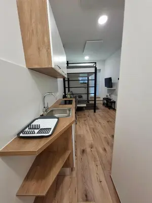 a kitchen with a sink and a counter top at apartma Pohorc - Praprot in Pohorje