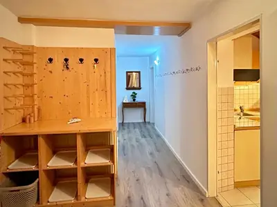 a room with a counter and a room with a kitchen at Al-Pine Apartment in Kranjska Gora