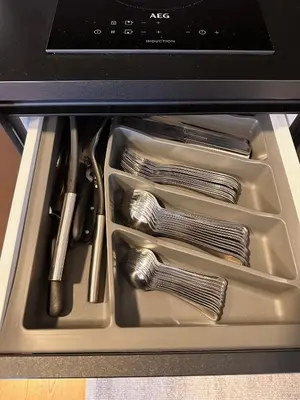 a drawer filled with utensils in an oven at Nordic Sun 1 in Kranjska Gora