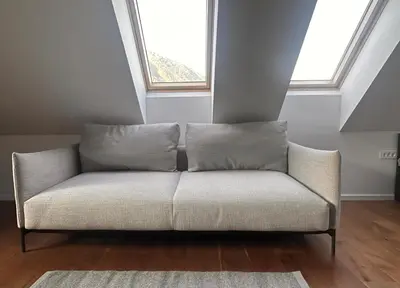 a white couch in a room with a window at Nordic Sun 1 in Kranjska Gora