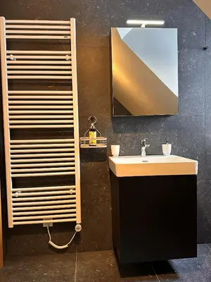 a bathroom with a sink and a mirror at Nordic Sun 1 in Kranjska Gora