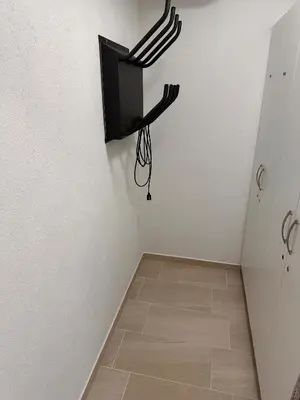 a room with a tv hanging on the wall at Nordic Sun 1 in Kranjska Gora