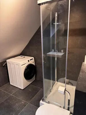 a shower stall in a bathroom with a toilet at Nordic Sun 1 in Kranjska Gora