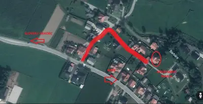 a map of a parking lot with a red arrow at Apartments Marja in Slovenj Gradec