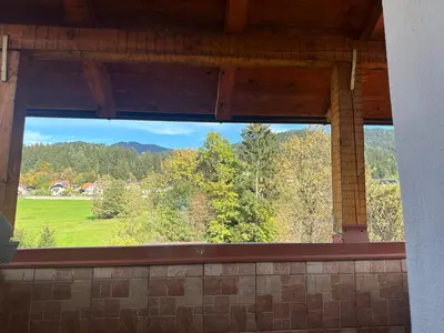 a window in a building with a view of a field at Apartments Marja in Slovenj Gradec
