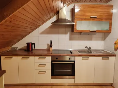a kitchen with a sink and a stove at Apartment Katja in Križe