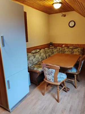 a living room with a table and a couch at Apartment Katja in Križe