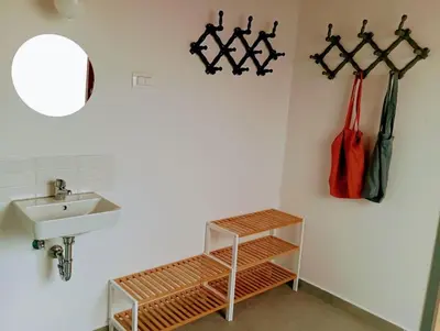 a bathroom with a sink and a mirror at Apartma Discovering Slovenia in Luče