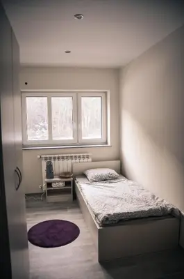 a bedroom with a bed and a window at Rosa Bed and Breakfast in Podgorje
