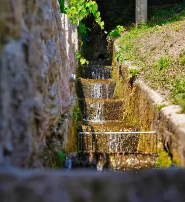 a set of stairs in a stone wall at House Tinka Bled in Bled