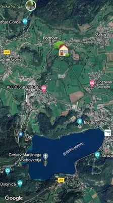 a map of a house with pink and green dots at Apartment Kovacic - Lake Bled in Bled