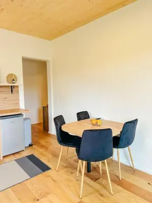 a dining room with a table and chairs at Apartment Kovacic - Lake Bled in Bled